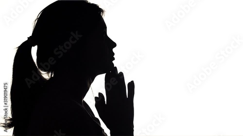 silhouette of young man thinking , guy seeking a solution of problem in meditation, concept of people feelings and life