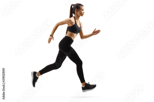 Active young woman running fast