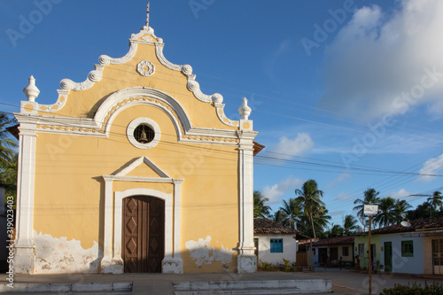 Porto de Pedras / Alagoas / Brazil. December, 30, 2019. View of Tatuamunha beach in Alagoas, northeastern Brazil during early summer. Tatuamunha Church. photo