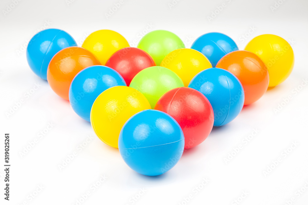 Colored plastic balls on white background. leisure and game items. round objects Colored plastic balls on white background. leisure and game items. round objects