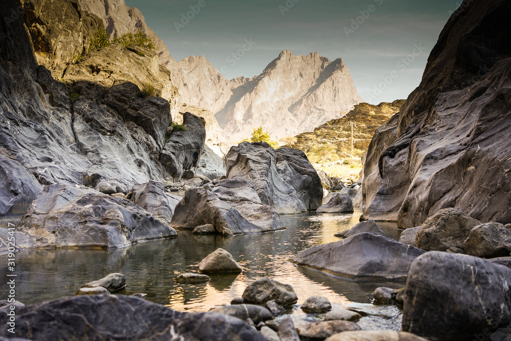 rocks in the water of an omani wadi