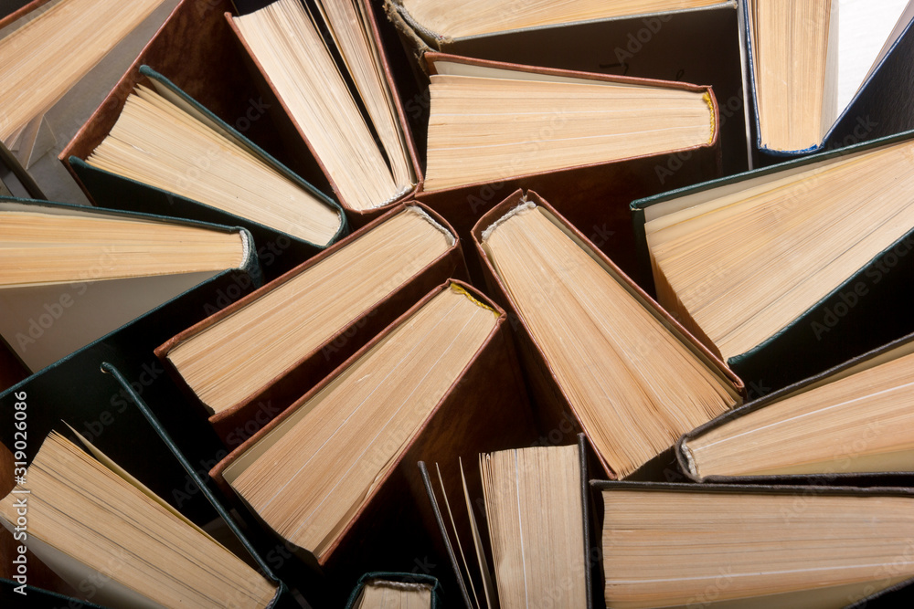 Obraz premium Old and used hardback books or text books from above.