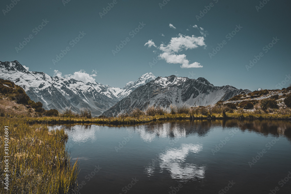 Amazing landscape with small tiny lake and mountains in the background Amazing landscape with small tiny lake and mountains in the background