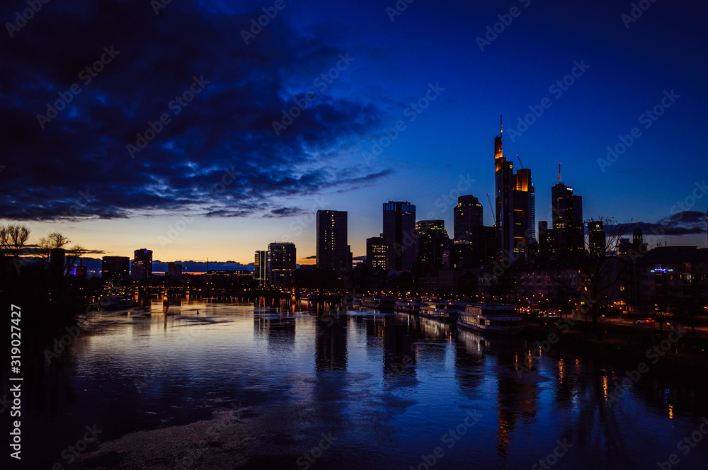 Spectacular view on the night city of Frankfurt reflecting in the river