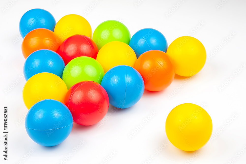 Colored plastic balls on white background. leisure and game items. round objects Colored plastic balls on white background. leisure and game items. round objects