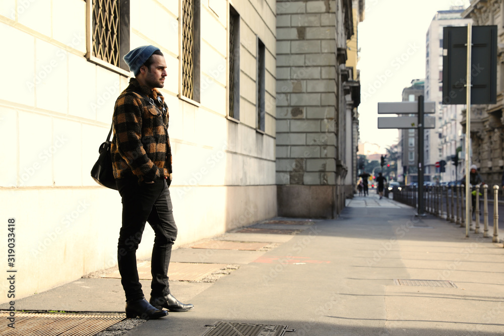 Young hipster walking in the street. Young hipster walking in the street.