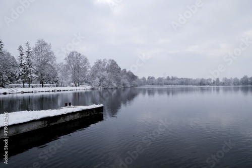 Footbridge on a lake with snow and frost, Bavaria, Germany © buunature