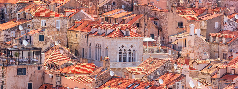 Summer mediterranean cityscape, banner - view of the roofs of the Old Town of Dubrovnik, on the Adriatic coast of Croatia - obrazy, fototapety, plakaty 