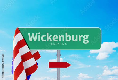 Wickenburg – Arizona. Road or Town Sign. Flag of the united states. Blue Sky. Red arrow shows the direction in the city. 3d rendering photo