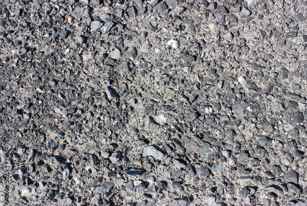 Crushed old asphalt pavement. Small gray-black pebbles. Crushed old asphalt pavement. Small gray-black pebbles.