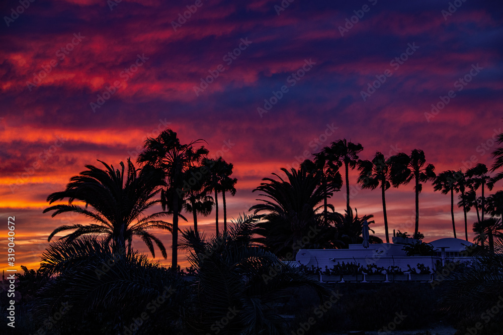  colorful sunset on the Spanish island of Gran Canaria in the Maspalomas dunes