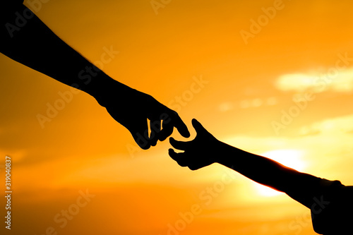 happy dad with a child in the park outdoors silhouette