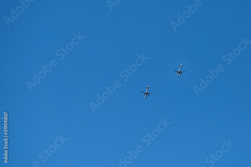 two planes in the blue sky