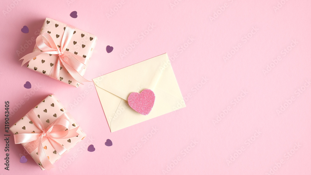 Valentines day background with gift boxes, love letter and hearts on pink. Valentine's Day celebration concept. Creative design for greeting card, party invitation, banner, flyer