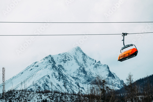 Bright orange cabin on a mountain cable car