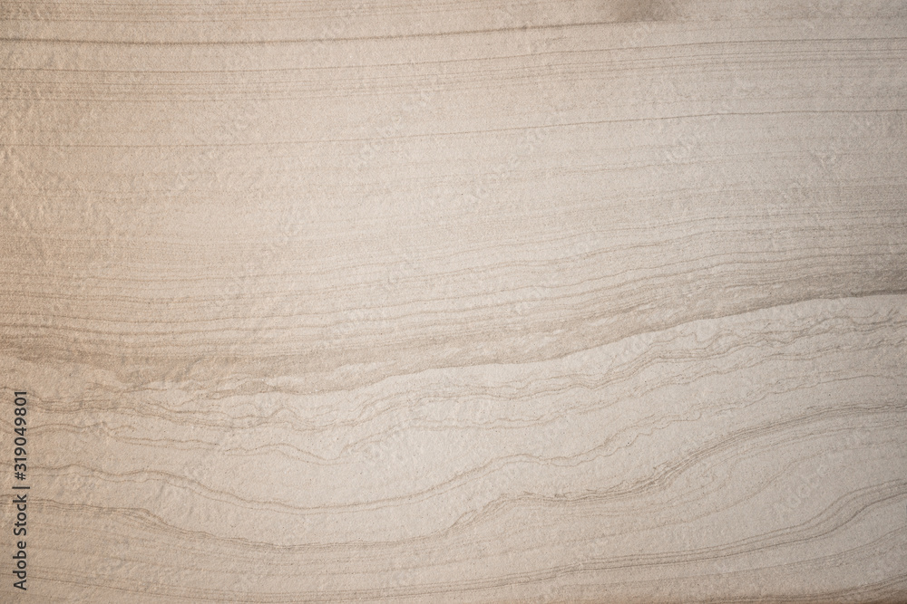 Obraz premium waves and lines on structured natural stone background texture