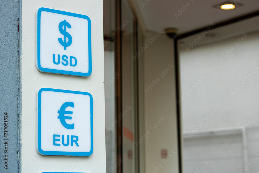 Obraz premium Dollar and euro signs. Written in blue on white signboard.
