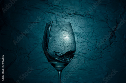 Water splash in a vineglass   photo