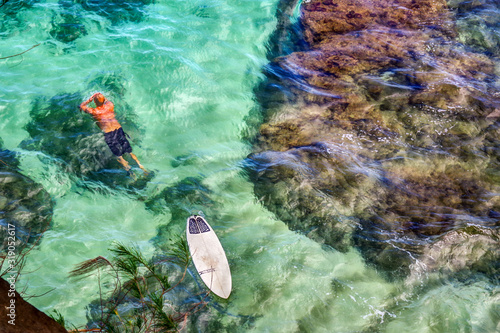 Princeville, Kauai, HI USA 04/16/19: Beautiful aqua blue water and reef at Hideaway Beach on Kauai's north shore.