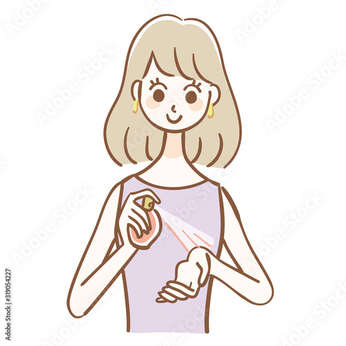 Woman spraying perfume on wrist
