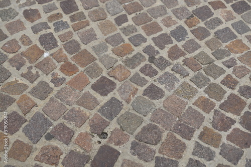A typical Italian pavement: Sampietrini (or Sanpietrini). Black and white.
