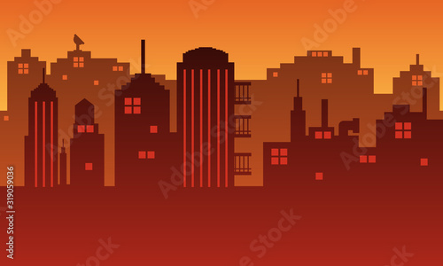 The city silhouette is at dusk with lots of buildings and a smoke