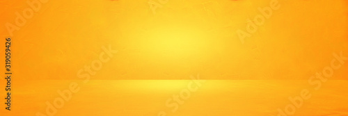 Abstract image of Empty space studio room yellow concrete wall texture background.