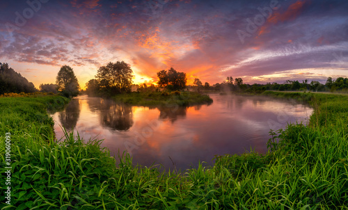 Fototapeta Naklejka Na Ścianę i Meble -  Beautiful sunrise over river banks - panorama