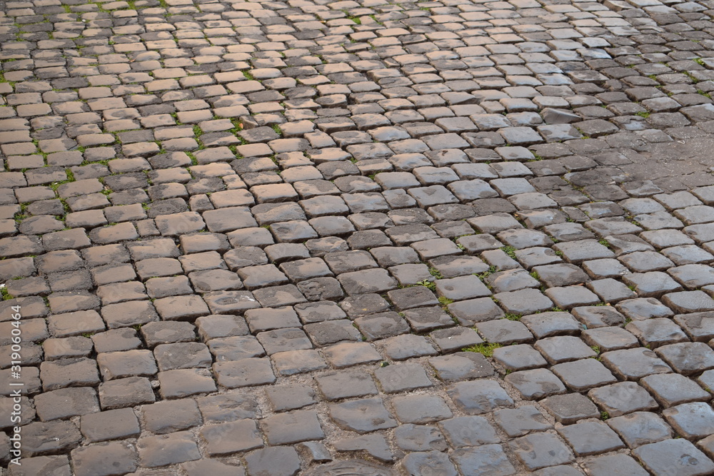 A typical Italian pavement: Sampietrini (or Sanpietrini). Black and white. A typical Italian pavement: Sampietrini (or Sanpietrini). Black and white.