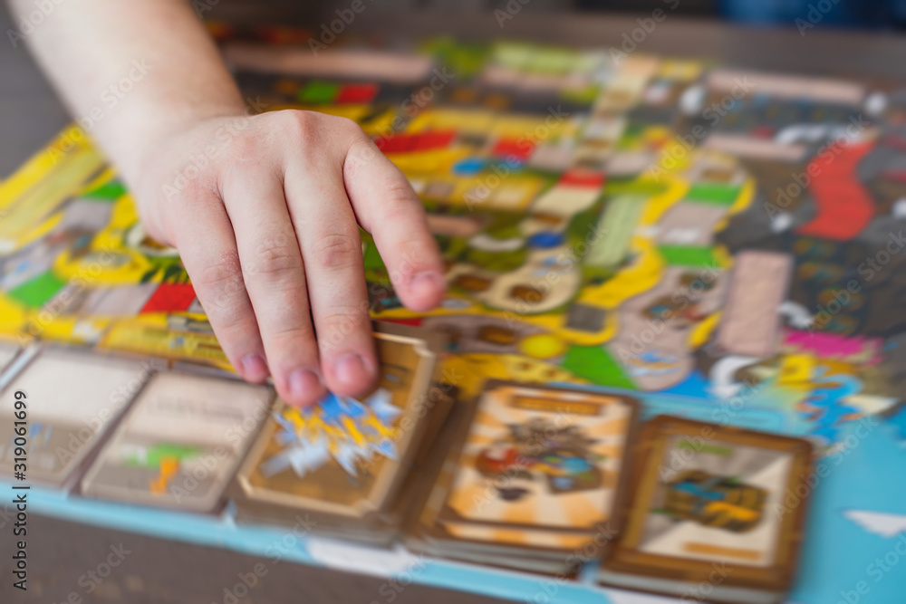 Process of playing board game and having fun with friends and family, board game concept, hand playing and roll the dice Process of playing board game and having fun with friends and family, board game concept, hand playing and roll the dice