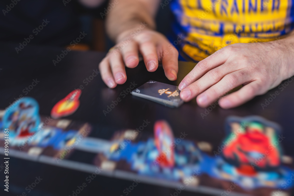 Process of playing board game and having fun with friends and family, board game concept, hand playing and roll the dice Process of playing board game and having fun with friends and family, board game concept, hand playing and roll the dice