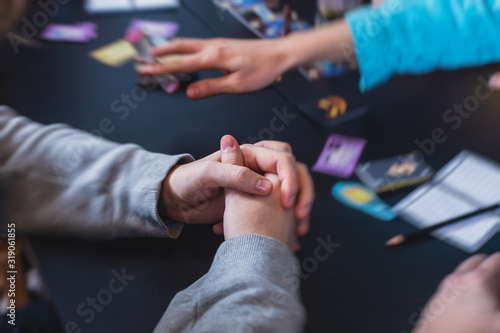 Process of playing board game and having fun with friends and family, board game concept, hand playing and roll the dice