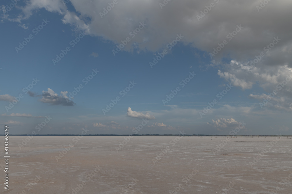 Dramatic clouds above salt plains Dramatic clouds above salt plains