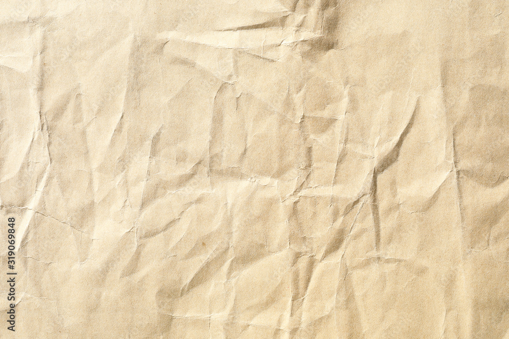 Obraz premium Crumpled brown paper background texture