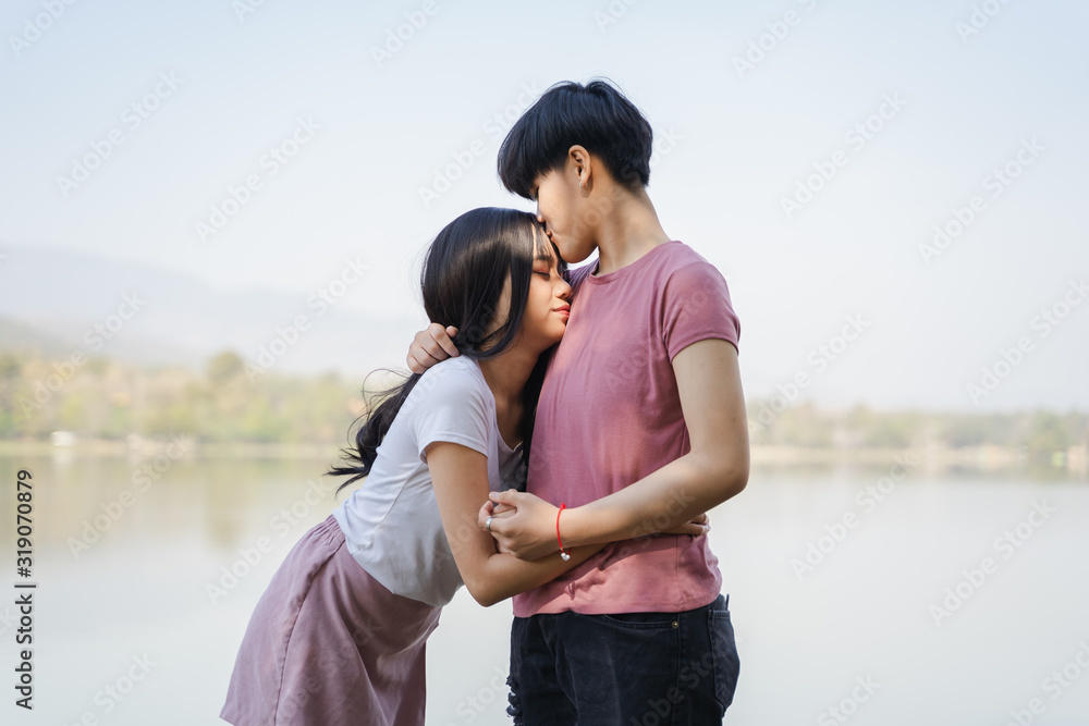 Beautiful lesbian couple embracing each other and kissing. Same sex young married female couple Concept. Beautiful lesbian couple embracing each other and kissing. Same sex young married female couple Concept.