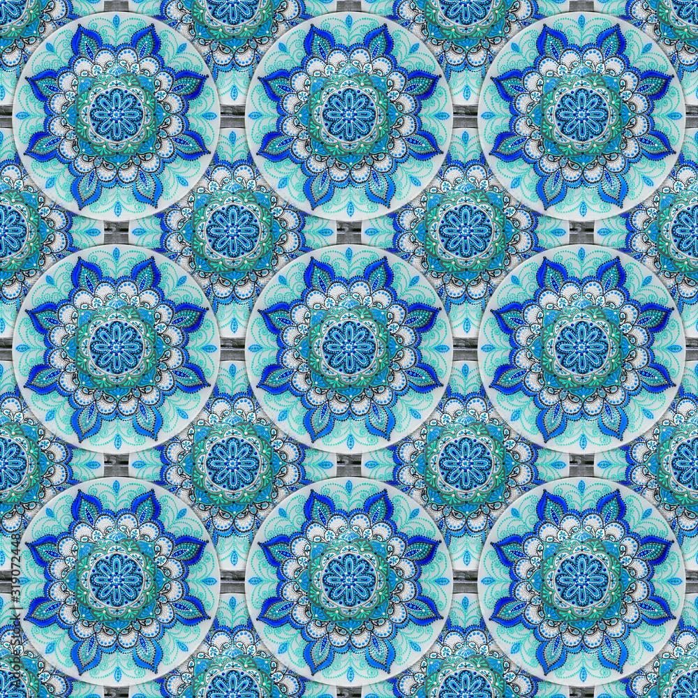 Seamless background from a set of decorative ceramic dishes hand-painted with acrylic paints with a floral pattern Seamless background from a set of decorative ceramic dishes hand-painted with acrylic paints with a floral pattern