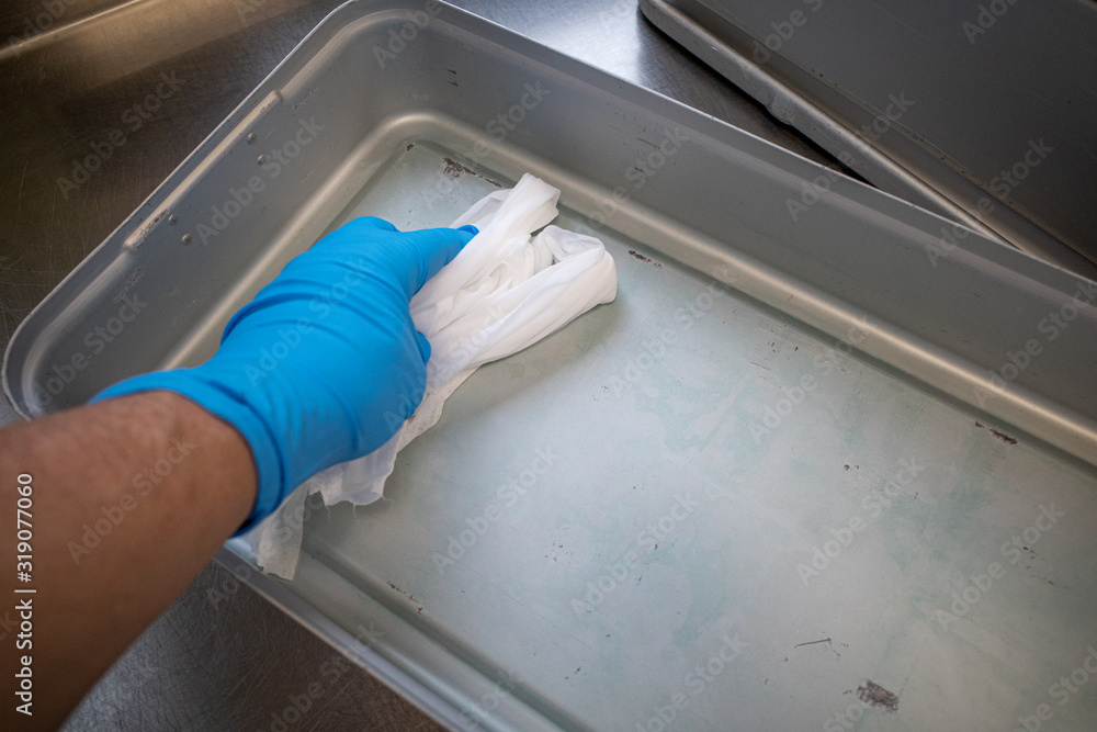 in a central sterilization the instrument containers are disinfected with an alcohol-soaked cloth