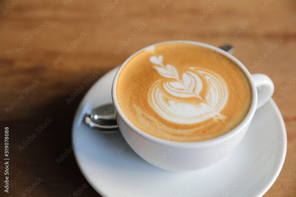 cappuccino or Latte art coffee made from milk on the wood table in coffee shop cappuccino or Latte art coffee made from milk on the wood table in coffee shop