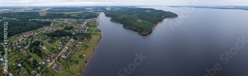 Aerial view of the Votkinsk Reservoir (on the river of Kama) and village Stepanovo on its coast. Perm Krai, Russia