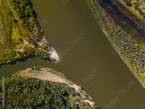 Aerial downward view of the river of Akhtuba and its green coasts, Russia photo