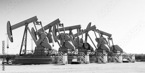 Working pump jacks and oil field equipment in central Texas photo