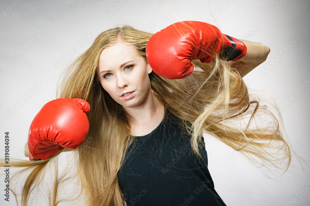 Girl in red gloves playing sports boxing Girl in red gloves playing sports boxing