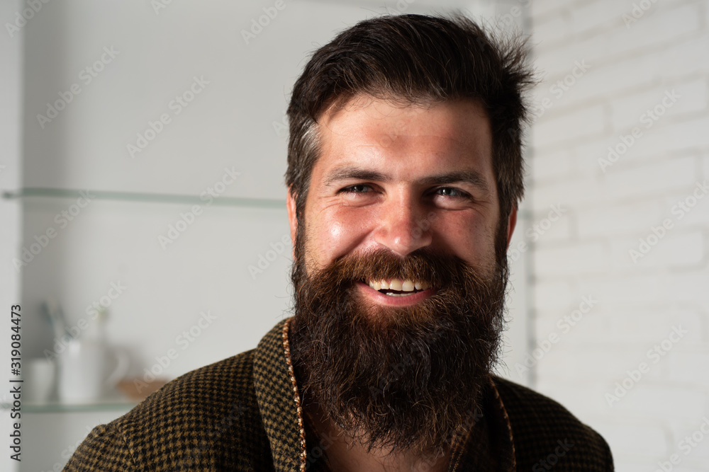 Man with beard. Guy with smiling face in home or bath clothes. Happy morning. Relaxing time. Morning hygiene. Man with beard. Guy with smiling face in home or bath clothes. Happy morning. Relaxing time. Morning hygiene.