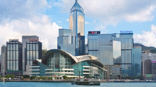 Fotografie, Obraz VIEW OF BUILDINGS AGAINST CLOUDY SKY