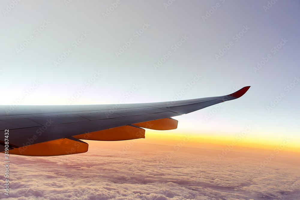 Wing of an aeroplane with sunset Wing of an aeroplane with sunset