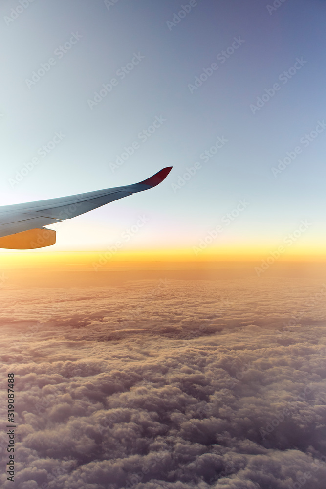 Wing of an aeroplane with sunset Wing of an aeroplane with sunset