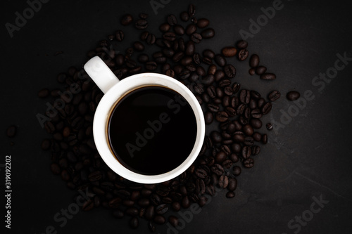 Background From Coffee Grains And A Cup From Coffee, The Top View