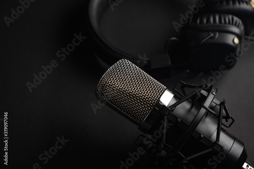 Podcasts and Stream. Flat lay. Studio condenser microphone black with professional headphones, top view with space for design.