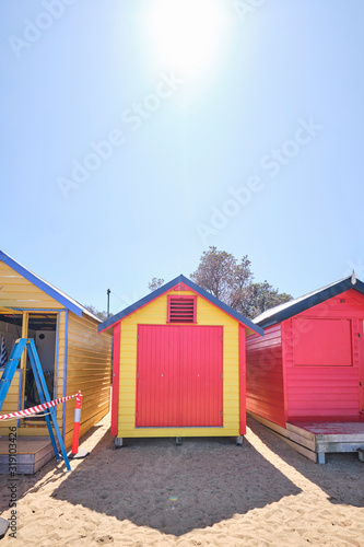 Brighton Beach huts/boxes on a blue sky sunny day with bright colours and textures © Orion Media Group