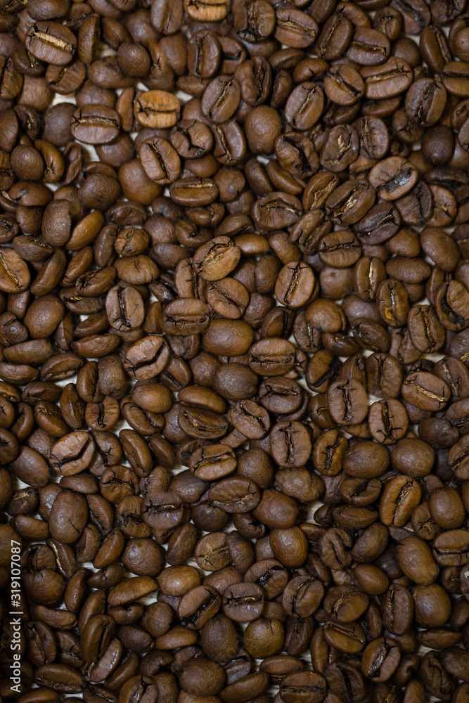 Fototapeta premium Fragnat roasted coffee beans close-up. Coffee background.